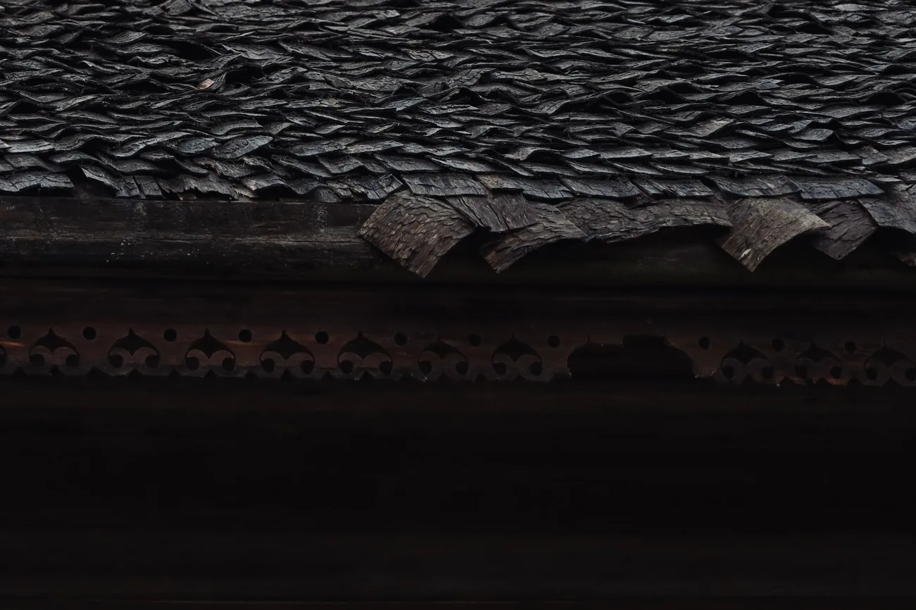 A weathered dark roof surface in need of treatment